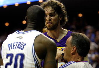 ORLANDO, FL - JUNE 11:  Pau Gasol #16 of the Los Angeles Lakers exchanges words with Mickael Pietrus #20 of the Orlando Magic in overtime of Game Four of the 2009 NBA Finals on June 11, 2009 at Amway Arena in Orlando, Florida.  NOTE TO USER:  User expressly acknowledges and agrees that, by downloading and or using this photograph, User is consenting to the terms and conditions of the Getty Images License Agreement.  (Photo by Chris Graythen/Getty Images)