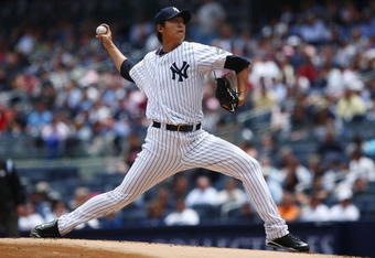 NEW YORK - JUNE 04:  Chien-Ming Wang #40 of the New York Yankees pitches against the Texas Rangers during their game on June 4, 2009 at Yankee Stadium in the Bronx borough of New York City.  (Photo by Chris McGrath/Getty Images)