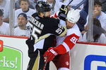 PITTSBURGH - JUNE 09:  Johan Franzen #93 of the Detroit Red Wings is checked into the boards by Sergei Gonchar #55 of the Pittsburgh Penguins during Game Six of the NHL Stanley Cup Finals at the Mellon Arena on June 9, 2009 in Pittsburgh, Pennsylvania.  (Photo by Jamie Sabau/Getty Images)