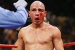 LAS VEGAS - JULY 26:  Miguel Cotto gets an eight-count after being knocked down by Antonio Margarito during their WBA welterweight title fight at the MGM Grand Garden Arena July 26, 2008 in Las Vegas, Nevada. Margarito won by TKO in the 11th round.  (Photo by Ethan Miller/Getty Images)