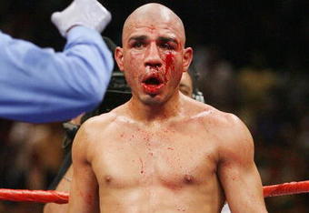 LAS VEGAS - JULY 26:  Miguel Cotto gets an eight-count after being knocked down by Antonio Margarito during their WBA welterweight title fight at the MGM Grand Garden Arena July 26, 2008 in Las Vegas, Nevada. Margarito won by TKO in the 11th round.  (Photo by Ethan Miller/Getty Images)