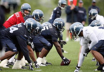 RENTON, WA - MAY 2:  Center Chris Spencer #65 prepares to snap the ball to Matt Hasselbeck #8 of the Seattle Seahawks during minicamp at the Seahawks training facility on May 2, 2009 in Renton, Washington. (Photo by Otto Greule Jr/Getty Images) 