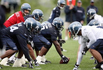 RENTON, WA - MAY 2:  Center Chris Spencer #65 prepares to snap the ball to Matt Hasselbeck #8 of the Seattle Seahawks during minicamp at the Seahawks training facility on May 2, 2009 in Renton, Washington. (Photo by Otto Greule Jr/Getty Images) 