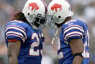ORCHARD PARK, NY - SEPTEMBER 21:  Marshawn Lynch #23 and Fred Jackson #22 of the Buffalo Bills celebrate Lynch's first touchdown against the Oakland Raiders on September 21, 2008 at Ralph Wilson Stadium in Orchard Park, New York. Buffalo won 24-23. (Photo by Rick Stewart/Getty Images)