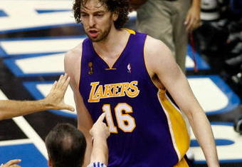 ORLANDO, FL - JUNE 11:  Pau Gasol #16 of the Los Angeles Lakers looks over at Mickael Pietrus #20 (not pictured) as referee Mike Callahan #24 points over at Gasol after he was fouled by Pietrus in overtime in Game Four of the 2009 NBA Finals on June 11, 2009 at Amway Arena in Orlando, Florida.  NOTE TO USER:  User expressly acknowledges and agrees that, by downloading and or using this photograph, User is consenting to the terms and conditions of the Getty Images License Agreement.  (Photo by Ronald Martinez/Getty Images)