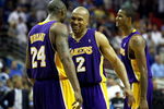 ORLANDO, FL - JUNE 11:  Kobe Bryant #24 and Derek Fisher #2 of the Los Angeles Lakers celebrate in the final moments of the Lakers' overtime win over the Orlando Magic in Game Four of the 2009 NBA Finals on June 11, 2009 at Amway Arena in Orlando, Florida.  NOTE TO USER:  User expressly acknowledges and agrees that, by downloading and or using this photograph, User is consenting to the terms and conditions of the Getty Images License Agreement.  (Photo by Elsa/Getty Images)