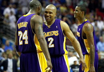 ORLANDO, FL - JUNE 11:  Kobe Bryant #24 and Derek Fisher #2 of the Los Angeles Lakers celebrate in the final moments of the Lakers' overtime win over the Orlando Magic in Game Four of the 2009 NBA Finals on June 11, 2009 at Amway Arena in Orlando, Florida.  NOTE TO USER:  User expressly acknowledges and agrees that, by downloading and or using this photograph, User is consenting to the terms and conditions of the Getty Images License Agreement.  (Photo by Elsa/Getty Images)