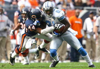 CHICAGO - NOVEMBER 02:  Wide receiver Calvin Johnson #81 of the Detroit Lions makes a reception and is brought down by Kevin Payne #44 of the Chicago Bears during the second quarter at Soldier Field on November 2, 2008 in Chicago, Illinois.  (Photo by Jeff Gross/Getty Images)