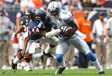CHICAGO - NOVEMBER 02:  Wide receiver Calvin Johnson #81 of the Detroit Lions makes a reception and is brought down by Kevin Payne #44 of the Chicago Bears during the second quarter at Soldier Field on November 2, 2008 in Chicago, Illinois.  (Photo by Jeff Gross/Getty Images)