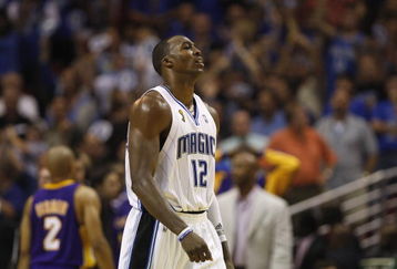 ORLANDO, FL - JUNE 11:  Dwight Howard #12 of the Orlando Magic head to the sideline during Game Four of the 2009 NBA Finals against the Los Angeles Lakers on June 11, 2009 at Amway Arena in Orlando, Florida. The Lakers won in overtime 99-91. NOTE TO USER:  User expressly acknowledges and agrees that, by downloading and or using this photograph, User is consenting to the terms and conditions of the Getty Images License Agreement. (Photo by Chris Graythen/Getty Images)