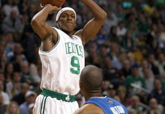 BOSTON - MAY 17:  Rajon Rondo #9 of the Boston Celtics takes a shot as Rafer Alston #9 of the Orlando Magic defends in Game Seven of the Eastern Conference Semifinals during the 2009 NBA Playoffs at TD Banknorth Garden on May 17, 2009 in Boston, Massachusetts. NOTE TO USER: User expressly acknowledges and agrees that, by downloading and or using this photograph, User is consenting to the terms and conditions of the Getty Images License Agreement.  (Photo by Elsa/Getty Images)