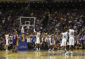 ORLANDO, FL - JUNE 11:  Dwight Howard #12 of the Orlando Magic shoots a free throw in the closing seconds of regulation during Game Four of the 2009 NBA Finals against the Los Angeles Lakers on June 11, 2009 at Amway Arena in Orlando, Florida. The Lakers won in overtime 99-91. NOTE TO USER:  User expressly acknowledges and agrees that, by downloading and or using this photograph, User is consenting to the terms and conditions of the Getty Images License Agreement. (Photo by Chris Graythen/Getty Images)
