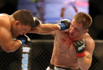 CHICAGO- OCTOBER 25:  Tyson Griffin (L) punches Sean Sherk in a Lightweight bout at UFC's Ultimate Fight Night at Allstate Arena on October 25, 2008 in Chicago, Illinois. (Photo by Tasos Katopodis/Getty Images)