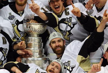DETROIT - JUNE 12:  Sidney Crosby #87 and the Pittsburgh Penguins celebrates with the Stanley Cup after defeating the Detroit Red Wings by a score of 2-1 to win Game Seven and the 2009 NHL Stanley Cup Finals at Joe Louis Arena on June 12, 2009 in Detroit, Michigan.  (Photo by Jim McIsaac/Getty Images)