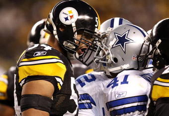 PITTSBURGH - DECEMBER 07:  Andre Frazier #54 of the Pittsburgh Steelers has words with Terence Newman #41 of the Dallas Cowboys during the second quarter on December 7, 2008 at Heinz Field in Pittsburgh, Pennsylvania. Pittsburgh won the game 20-13.  (Photo by Gregory Shamus/Getty Images)