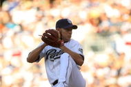 SAN DIEGO - APRIL 06: Pitcher Jake Peavy #44 of the San Diego Padres throws a pitch against the Los Angeles Dodgers on April 6, 2009 at Petco Park in San Diego, California. The Dodgers won 4-1. (Photo by Stephen Dunn/Getty Images)