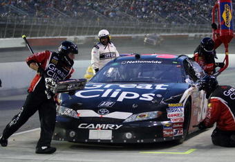 DARLINGTON, SC - MAY 08: Jason Leffler, driver of the Great Clips Toyota, makes a pit stop during the NASCAR Nationwide Series Diamond Hill Plywood 200 on May 8, 2009 at Darlington Raceway in Darlington, South Carolina.  (Photo by Elsa/Getty Images for NASCAR)
