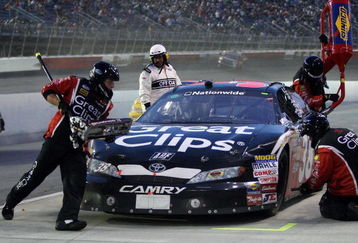 DARLINGTON, SC - MAY 08: Jason Leffler, driver of the Great Clips Toyota, makes a pit stop during the NASCAR Nationwide Series Diamond Hill Plywood 200 on May 8, 2009 at Darlington Raceway in Darlington, South Carolina.  (Photo by Elsa/Getty Images for NASCAR)