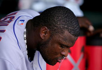 SAN FRANCISCO - MAY 16:  Luis Castillo #1 of the New York Mets dumps water over his head to keep cool during their game against the San Francisco Giants at AT&T Park on May 16, 2009 in San Francisco, California.  The Mets won 9-6.  (Photo by Ezra Shaw/Getty Images)