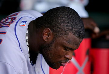 SAN FRANCISCO - MAY 16:  Luis Castillo #1 of the New York Mets dumps water over his head to keep cool during their game against the San Francisco Giants at AT&T Park on May 16, 2009 in San Francisco, California.  The Mets won 9-6.  (Photo by Ezra Shaw/Getty Images)