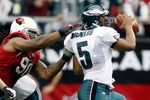 GLENDALE, AZ - JANUARY 18:  Quarterback Donovan McNabb #5 of the Philadelphia Eagles looks to avoid a sack from defensive end Darnell Dockett #90 of the Arizona Cardnals during the NFC championship game on January 18, 2009 at University of Phoenix Stadium in Glendale, Arizona.  (Photo by Jamie Squire/Getty Images)