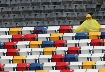CONCORD, NC - MAY 23:  A race fan sits in the stands  in a rain delay during practice for the NASCAR Sprint Cup Series Coca-Cola 600 on May 23, 2009 at Lowe's Motor Speedway in Concord, North Carolina.  (Photo by Scott Halleran/Getty Images for NASCAR)