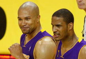 ORLANDO, FL - JUNE 11:  Derek Fisher #2 and Trevor Ariza #3 of the Los Angeles Lakers react after defeating the Orlando Magic in Game Four of the 2009 NBA Finals on June 11, 2009 at Amway Arena in Orlando, Florida.  The Lakers won 99-91 in overtime.  NOTE TO USER:  User expressly acknowledges and agrees that, by downloading and or using this photograph, User is consenting to the terms and conditions of the Getty Images License Agreement.