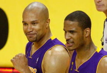 ORLANDO, FL - JUNE 11:  Derek Fisher #2 and Trevor Ariza #3 of the Los Angeles Lakers react after defeating the Orlando Magic in Game Four of the 2009 NBA Finals on June 11, 2009 at Amway Arena in Orlando, Florida.  The Lakers won 99-91 in overtime.  NOTE TO USER:  User expressly acknowledges and agrees that, by downloading and or using this photograph, User is consenting to the terms and conditions of the Getty Images License Agreement.