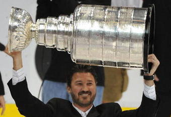 DETROIT - JUNE 12:  Mario Lemieux of the Pittsburgh Penguins celebrates with the Stanley Cup after defeating the Detroit Red Wings by a score of 2-1 to win Game Seven and the 2009 NHL Stanley Cup Finals at Joe Louis Arena on June 12, 2009 in Detroit, Michigan.  (Photo by Harry How/Getty Images)
