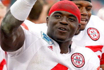 JACKSONVILLE, FL - JANUARY 1:  Larry Asante #4 of the Nebraska Cornhuskers celebrates a victory following the Konica Minolta Gator Bowl against the Clemson Tigers at Jacksonville Municipal Stadium January 1, 2009 in Jacksonville, Florida.  (Photo by Sam Greenwood/Getty Images)