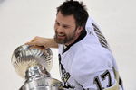 DETROIT - JUNE 12:  Petr Sykora #17 of the Pittsburgh Penguins celebrates with the Stanley Cup after defeating the Detroit Red Wings by a score of 2-1 to win Game Seven and the 2009 NHL Stanley Cup Finals at Joe Louis Arena on June 12, 2009 in Detroit, Michigan.  (Photo by Jamie Sabau/Getty Images)