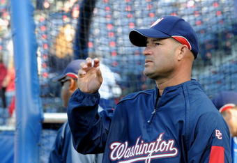ATLANTA - APRIL 11:  Manager Manny Acta #14 of  the Washington Nationals watches batting practice before play against the Atlanta Braves on April 11, 2009 at Turner Field in Atlanta, Georgia.  (Photo by Al Messerschmidt/Getty Images) 