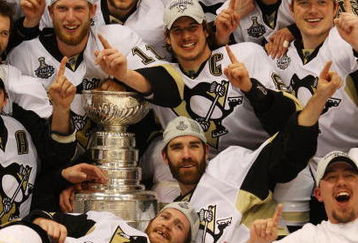 DETROIT - JUNE 12:  Sidney Crosby #87 and the Pittsburgh Penguins celebrates with the Stanley Cup after defeating the Detroit Red Wings by a score of 2-1 to win Game Seven and the 2009 NHL Stanley Cup Finals at Joe Louis Arena on June 12, 2009 in Detroit, Michigan.  (Photo by Jim McIsaac/Getty Images)