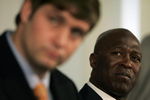 LAKE FOREST, IL - APRIL 3:  Chicago Bears head coach Lovie Smith looks on as new quarterback Jay Cutler talks to the media  during a press conference on April 3, 2009 at Halas Hall in Lake Forest, Illinois. (Photo by Jim Prisching/Getty Images)