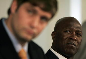 LAKE FOREST, IL - APRIL 3:  Chicago Bears head coach Lovie Smith looks on as new quarterback Jay Cutler talks to the media  during a press conference on April 3, 2009 at Halas Hall in Lake Forest, Illinois. (Photo by Jim Prisching/Getty Images)