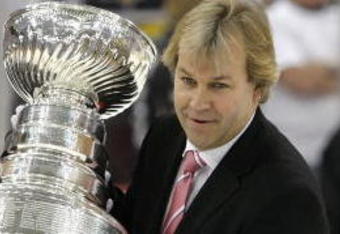 PITTSBURGH - JUNE 04:  Curators from the Hockey Hall of Fame, Craig Campbell and Phil Pritchard carry the Stanley Cup onto the ice after game six of the 2008 NHL Stanley Cup Finals at Mellon Arena on June 4, 2008 in Pittsburgh. Pennsylvania. The Red Wings defeated the Penguins 3-2 to win the Stanley Cup Finals 4 games to 2.  (Photo by Dave Sandford/Getty Images)