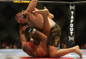 MANCHESTER, UNITED KINGDOM - APRIL 21:   Mike Bisping of England and Elvis Sinosic of Australia fight in action during a Light Heavyweight bout of the Ultimate Fighting Championship at the Manchester Evening News Arena on April 21, 2007 in Manchester, England (Photo by Gary M. Prior/Getty Images).