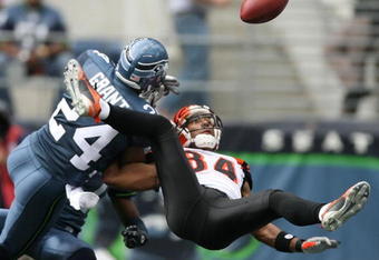 SEATTLE - SEPTEMBER 23:  Strong safety Deon Grant #24 of the Seattle Seahawks breaks up this pass in the end zone against wide receiver T.J. Houshmandzadeh #84 of the Cincinnati Bengals in the second half at Qwest Field on September 23, 2007 in Seattle, Washington.  The Seahawks defeated the Bengals 24-21.  (Photo by Otto Greule Jr/Getty Images)