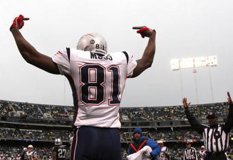 OAKLAND, CA - DECEMBER 14:  Randy Moss #81 of the New England Patriots celeberates after scoring a touchdwon against the Oakland Raiders during an NFL game on December 14, 2008 at the Oakland-Alameda County Coliseum in Oakland, California.  (Photo by Jed Jacobsohn/Getty Images)