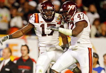 MIAMI - JANUARY 01: Kam Chancellor #17 of the Virginia Tech Hokies celebrates after making an interception with teammate Nekos Brown #47 against  the Cincinnati Bearcats the FedEx Orange Bowl at Dolphin Stadium on January 1, 2009 in Miami, Florida.  (Photo by Streeter Lecka/Getty Images)