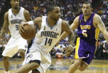 ORLANDO, FL - JUNE 11:  Jameer Nelson #14 of the Orlando Magic moves the ball against Jordan Farmar #5 of the Los Angeles Lakers in Game Four of the 2009 NBA Finals on June 11, 2009 at Amway Arena in Orlando, Florida. The Lakers won in overtime 99-91. NOTE TO USER:  User expressly acknowledges and agrees that, by downloading and or using this photograph, User is consenting to the terms and conditions of the Getty Images License Agreement. (Photo by Chris Graythen/Getty Images)