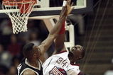 26 Jan 1999: Hakeem Olajuwon #34 of the Houston Rockets tips the ball during the game against the San Antonio Spurs at the Compaq Center in Houston, Texas. The Spurs defeated the Rockets 106-99.