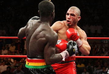 NEW YORK - JUNE 13:  Miguel Cotto punches Joshua Clottey during their WBO Welterweight title fight at Madison Square Garden on June 13, 2009 in New York City.  (Photo by Al Bello/Getty Images)