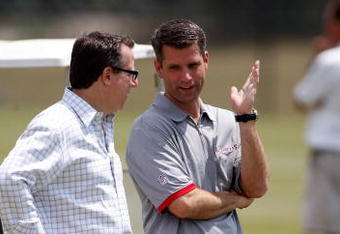 TAMPA - MAY 01:  General Manager Mark Dominik of the Tampa Bay Buccaneers talks with team owner Bryan Glazer during the Buccaneers Rookie Minicamp at One Buccaneer Place on May 1, 2009 in Tampa, Florida.  (Photo by J. Meric/Getty Images)