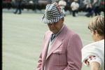 Coach Bear Bryant of the Alabama Crimson Tide watches his players during a game.