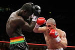 NEW YORK - JUNE 13:  Miguel Cotto punches Joshua Clottey during their WBO Welterweight title fight at Madison Square Garden on June 13, 2009 in New York City.  (Photo by Al Bello/Getty Images)
