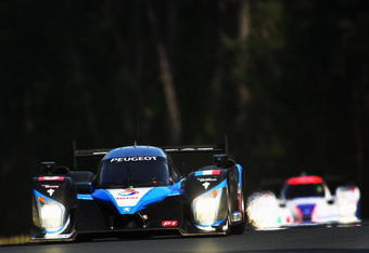 LE MANS, FRANCE - JUNE 13:  The Peugeot Sport Total 908 HDi FAP of Alex Wurz of Austria, David Brabham of Great Britain and Marc Gene of Spain drives during the 77th running of the Le Mans 24 Hour race at the Circuit des 24 Heures du Mans on June 13, 2009 in Le Mans, France.  (Photo by Bryn Lennon/Getty Images)
