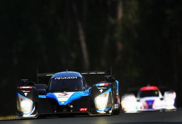 LE MANS, FRANCE - JUNE 13:  The Peugeot Sport Total 908 HDi FAP of Alex Wurz of Austria, David Brabham of Great Britain and Marc Gene of Spain drives during the 77th running of the Le Mans 24 Hour race at the Circuit des 24 Heures du Mans on June 13, 2009 in Le Mans, France.  (Photo by Bryn Lennon/Getty Images)