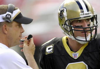 TAMPA, FL - SEPTEMBER 16:  Coach Sean Payton and quarterback Drew Brees #9 of  the New Orleans Saints discuss play against the Tampa Bay Buccaneers during a week-two NFL game on September 16, 2007 in Tampa, Florida.  The Bucs won 31 - 14.(Photo by Al Messerschmidt/Getty Images)