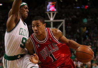 BOSTON - MAY 02:  Derrick Rose #1 of the Chicago Bulls drives to the net as Rajon Rondo #9 of the Boston Celtics defends in Game Seven of the Eastern Conference Quarterfinals during the 2009 NBA Playoffs at TD Banknorth Garden on May 2, 2009 in Boston, Massachusetts. The Celtics defeated the Bulls 109-99. NOTE TO USER: User expressly acknowledges and agrees that, by downloading and or using this photograph, User is consenting to the terms and conditions of the Getty Images License Agreement.  (Photo by Elsa/Getty Images)